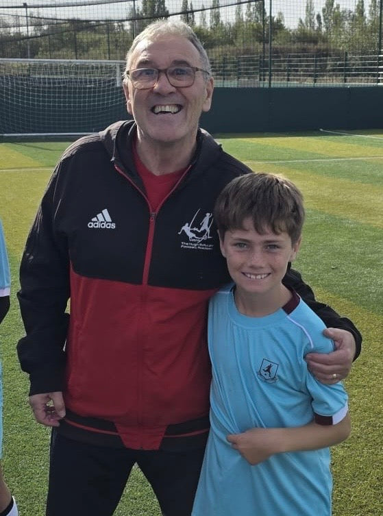 Jax with former Liverpool FC youth coach Hugh McAuley during the Manchester leg of his UK football tour. McAuley played an important role in the development of players including Steven Gerrard, Michael Owen, Jamie Carragher and Robbie Fowler.