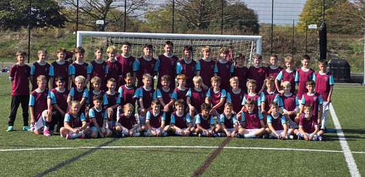 Jax seated in the centre of the front row with 44 players at the beginning of the West Ham football tour