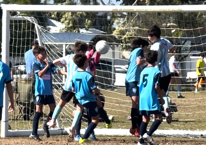 Jax heading a goal for Palm Beach Blue during the 2026 junior soccer season